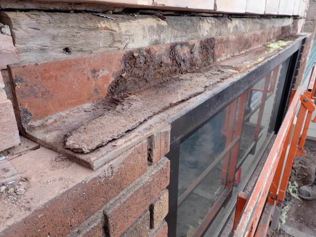 Pack rust build-up on window lintel.