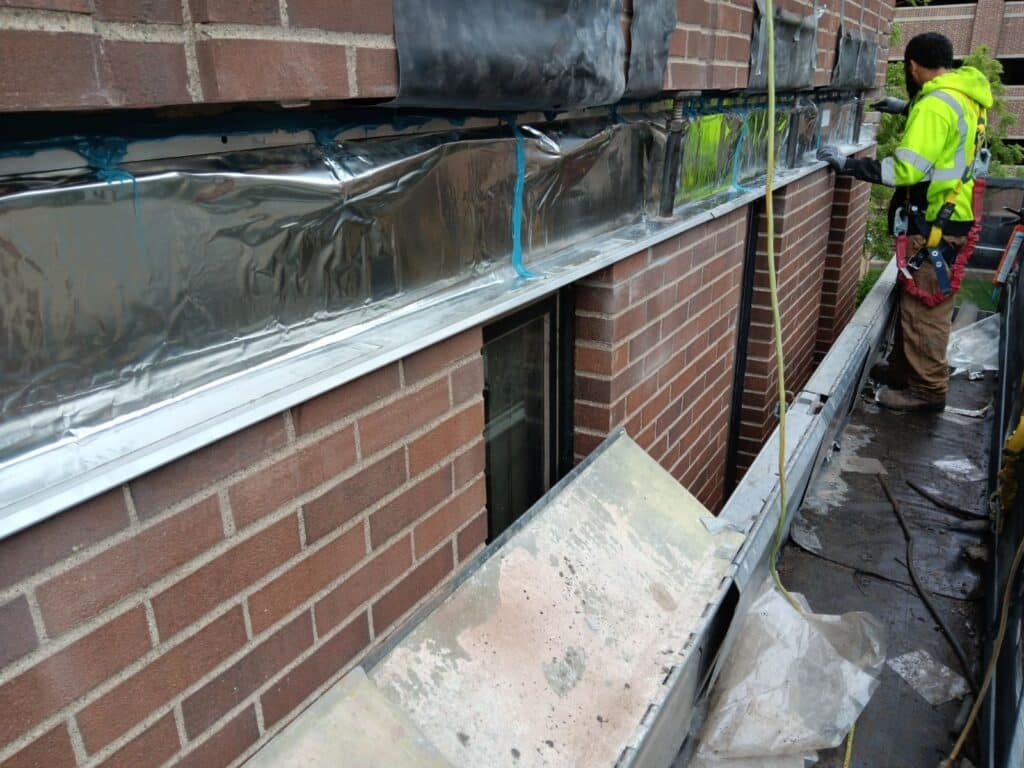 Properly flashed and protected steel relief angle.