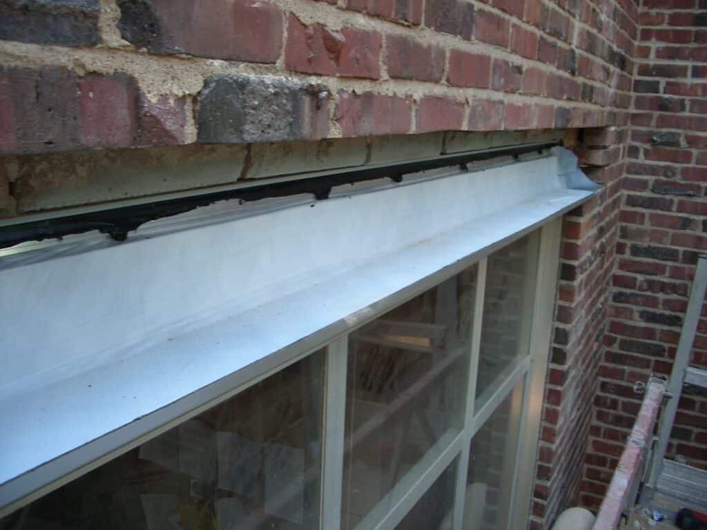 Window lintel with proper through-wall flashing.