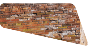 Brick surface showing signs of flaking and material loss near edges.
