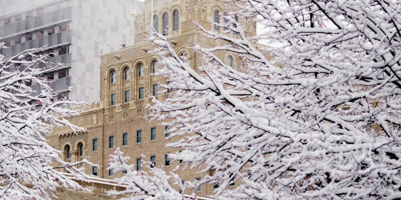 Vertical shot of the Plummer Building covered in the snow in the daylight in Rochester, Minnesota by wirestock